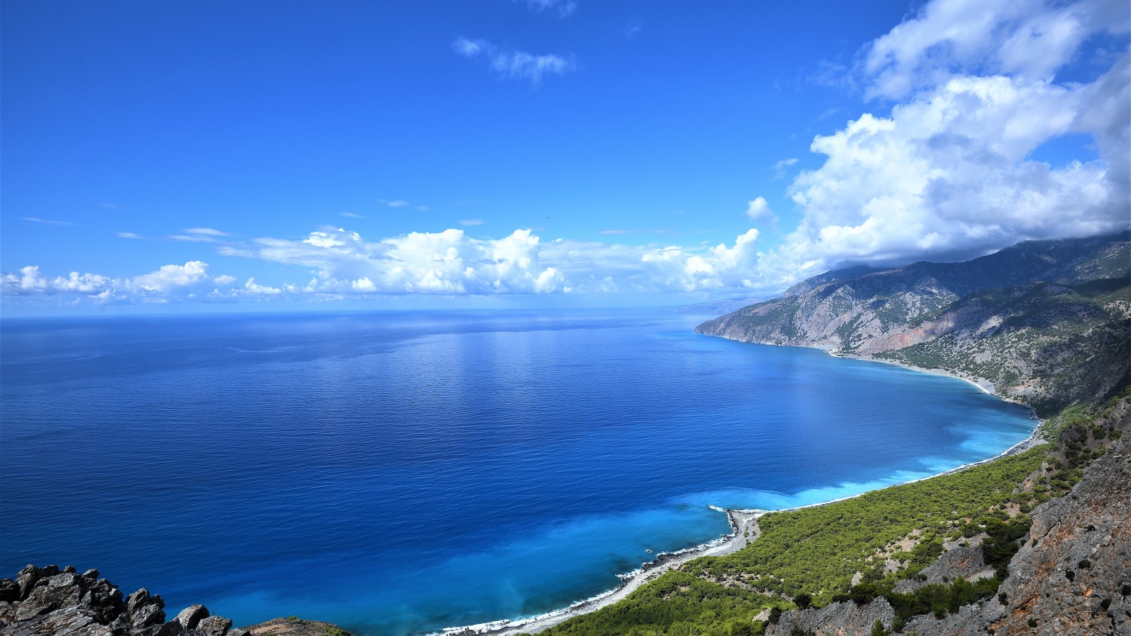 Crete's serene shores are fringed by verdant landscapes