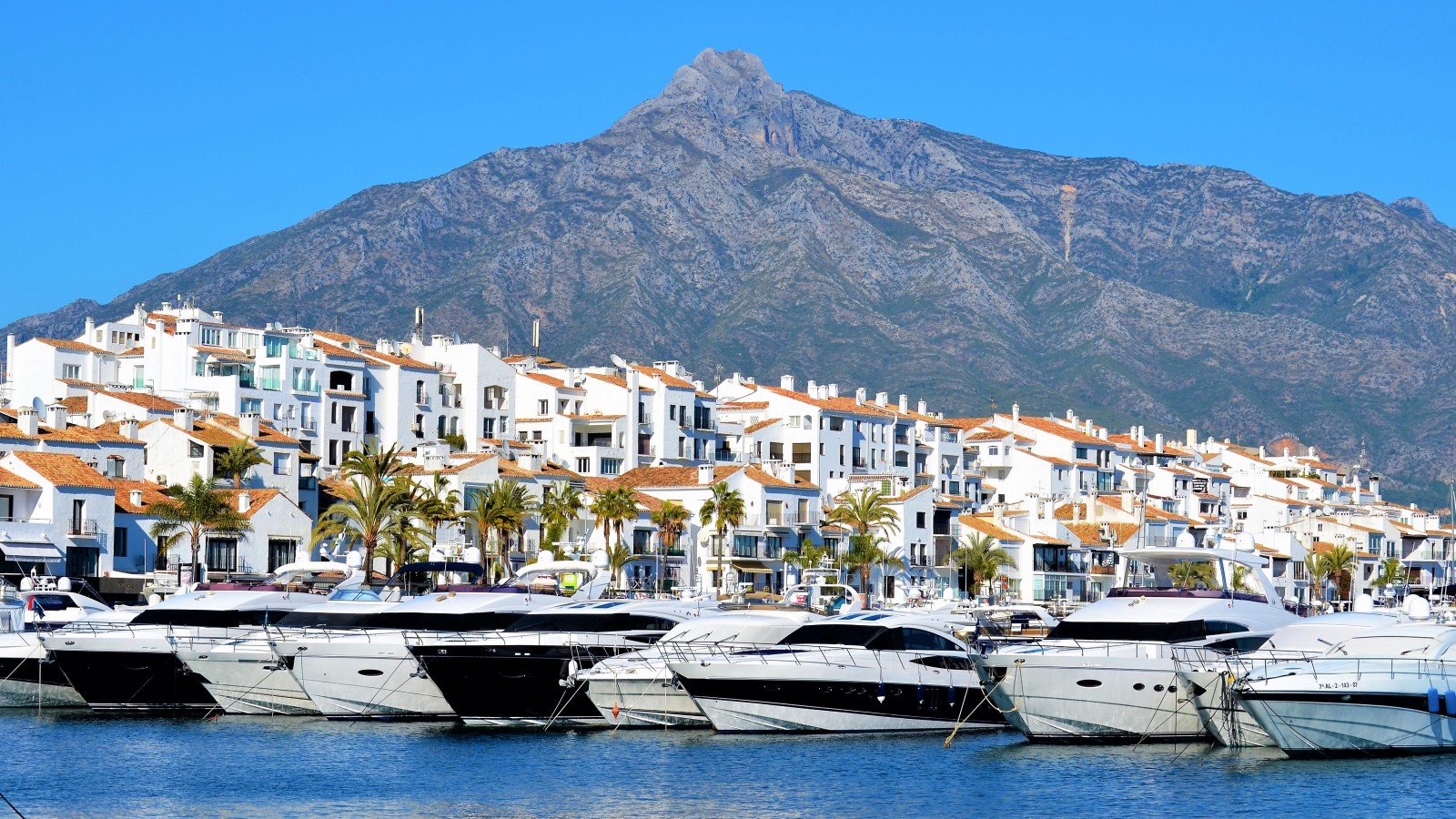 Luxury yachts lined up in the harbour of Puerto Banus, Marbella